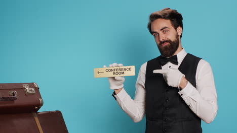 el botones tiene el símbolo de la sala de conferencias.