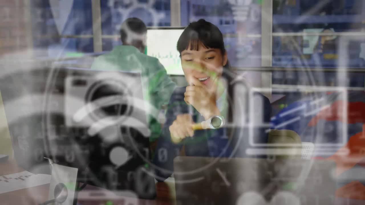 Animation of network of digital icons over smiling businesswoman in office