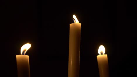 video of wax candles on a dark background