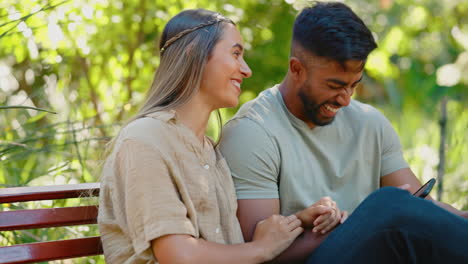 happy couple, phone and laughing on park