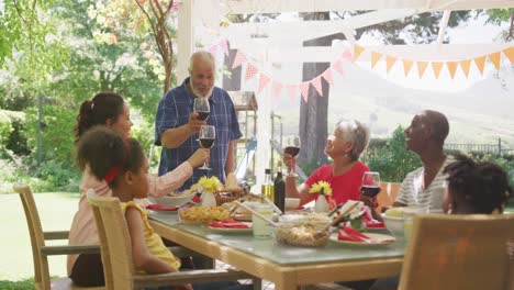 multi-generation african american family spending time in garden