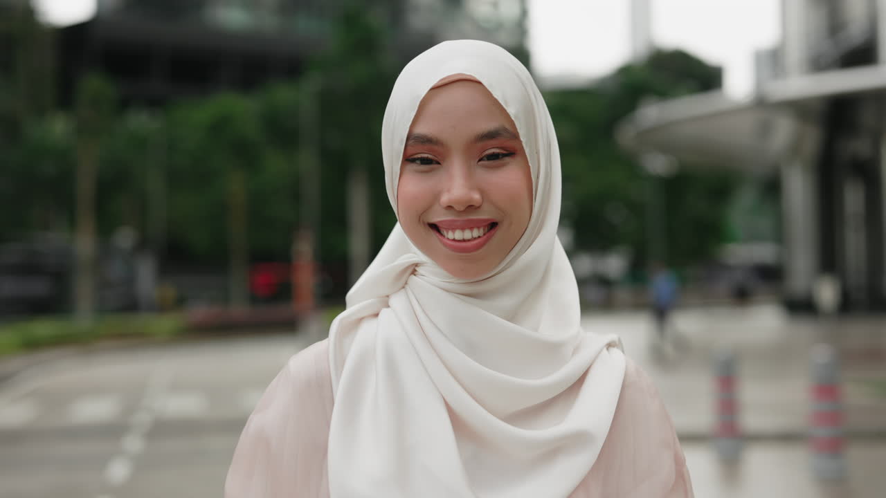 Smiling Woman Wearing Hijab in City