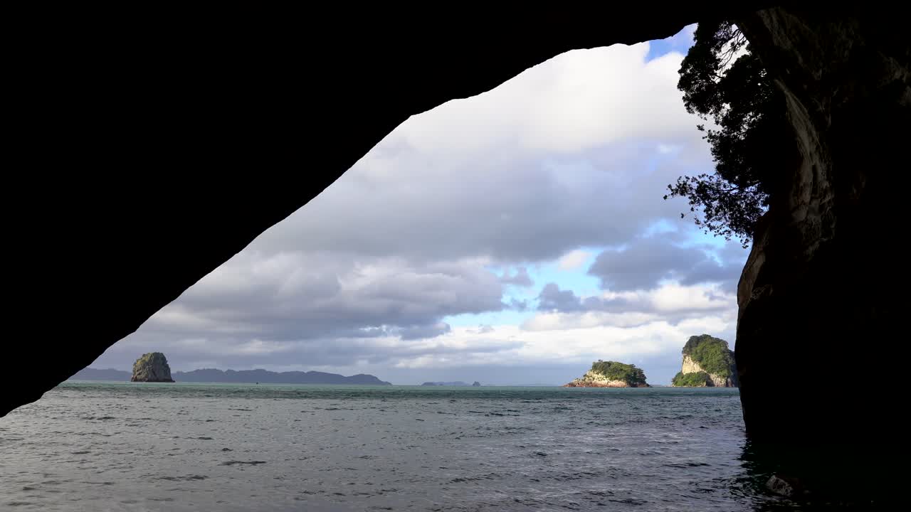 Close up inside Cathedral Cove towards sunny islets