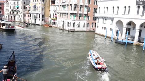 charming venice canal with bridge and colorful old buildings.