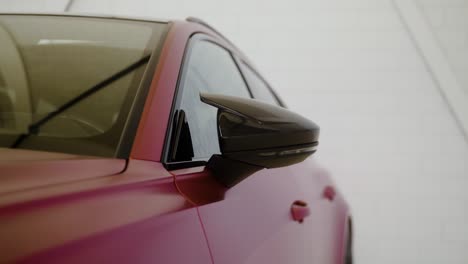 side view of a car while the side rearview mirror pops up