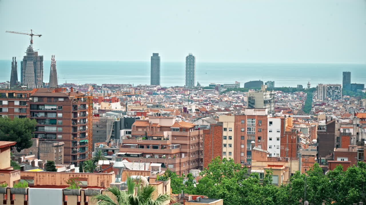 Panoramic view of Barcelona, multiple building's roofs, view from the Parc Guell, Spain