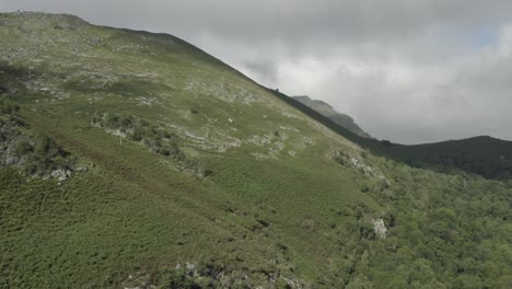 hautes-pyrénées mountains on sunny day with cloudy sky in background, france