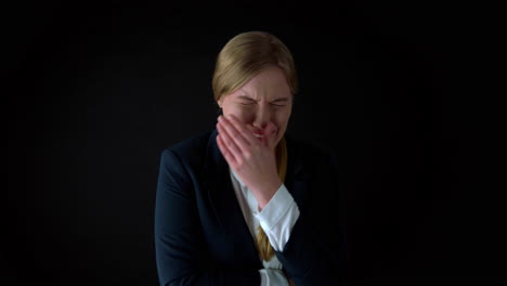 potrait shot of young woman in business outfit crying after losing her job,static