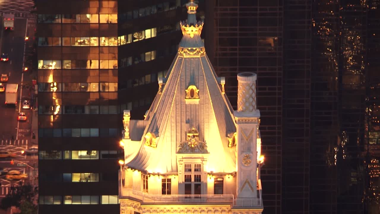 New york city zooming out, showcasing tall buildings and street lights, aerial view