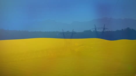 animation of flag of ukraine over field and electricity poles