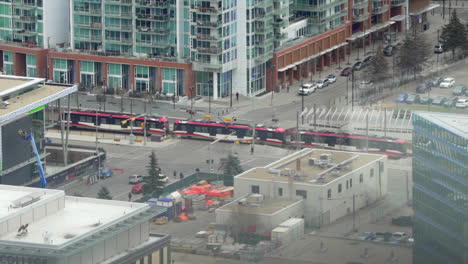 birds eye view of a train running through city calgary, alberta, canada