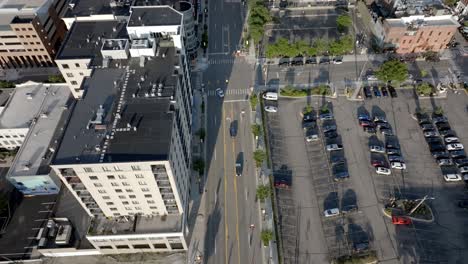 Downtown-Ann-Arbor,-Michigan-intersection-with-drone-video-tilting-up