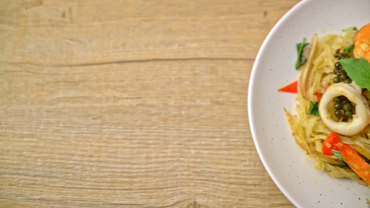 stir fried spicy noodles with sea food (Pad Cha Talay) - Thai food style