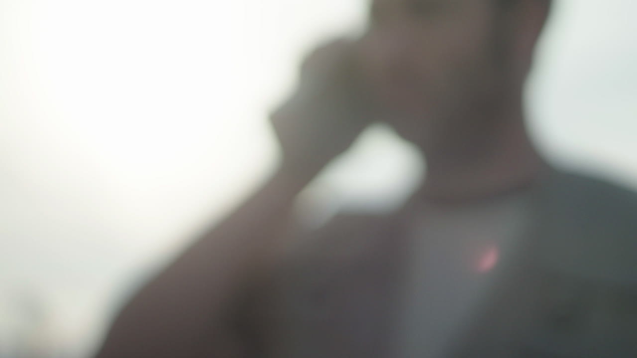 Blurred Image of Person on Phone