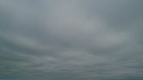 gray, gloomy clouds dissipate and a blue sky appears. time lapse.