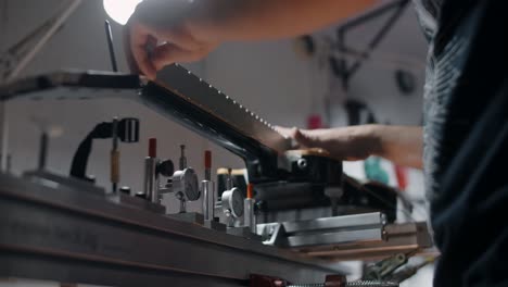 person working on a printing machine