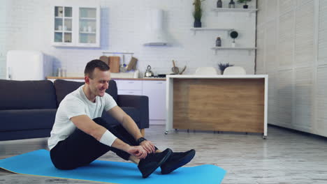 man during workout at home. young man doing exercising in living room at home