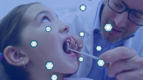 iconos médicos y conexiones de red animación sobre el dentista examinando los dientes del niño