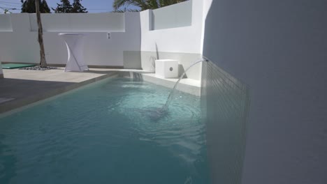 swimming pool with water fature in spain