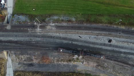 Aerial-view-of-a-train-making-a-turn-on-the-railway-track
