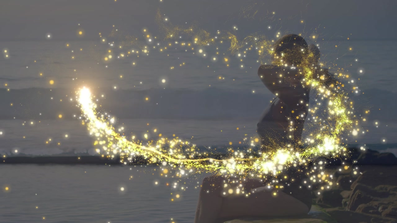 Animation of light trail over caucasian woman at beach