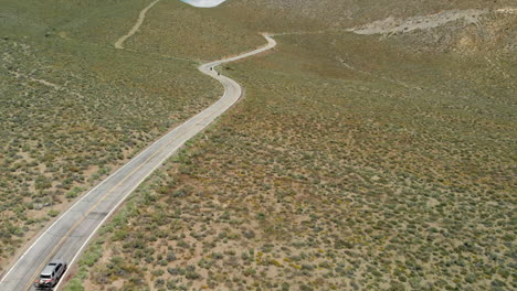 Slow-Motion-Aerial-of-Motorcycles-and-Car-on-Windy-Road