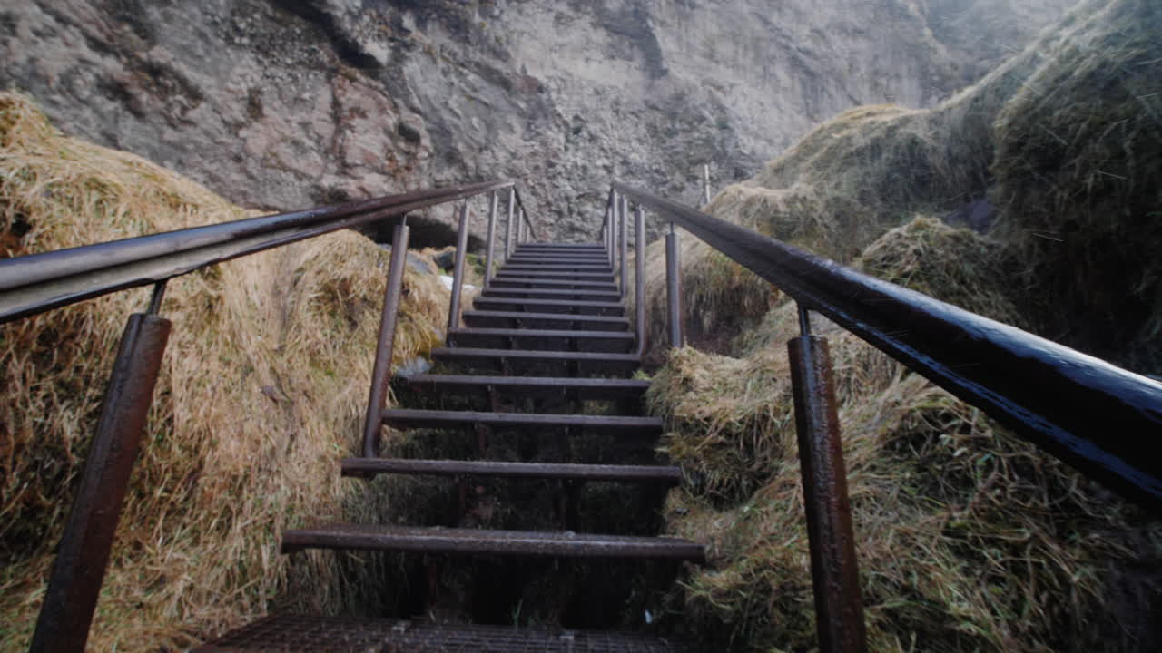 Metal Stairs Leading Up a Mountain Cliffside