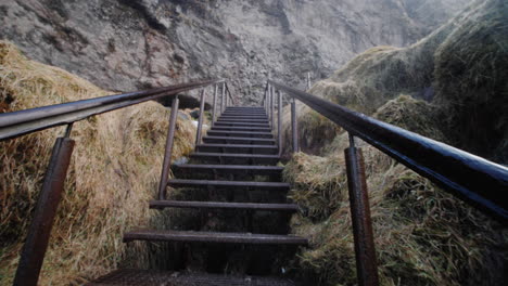 metal stairs leading up a mountain cliffside