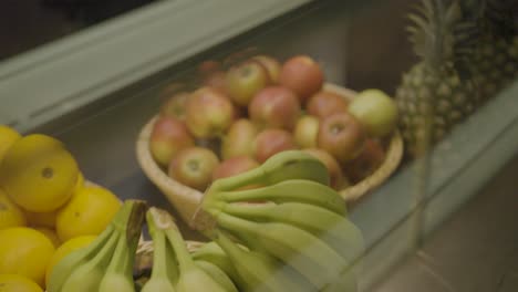 fresh bananas and assorted fruits on display in a market