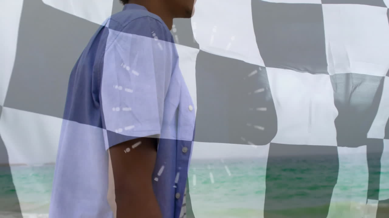 Standing by ocean, person with animation of checkered pattern and abstract elements