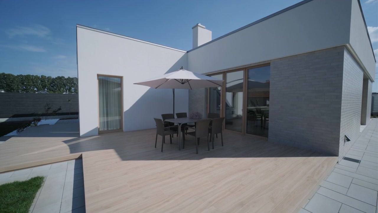 Modern House Exterior with Wooden Deck and Outdoor Dining Area