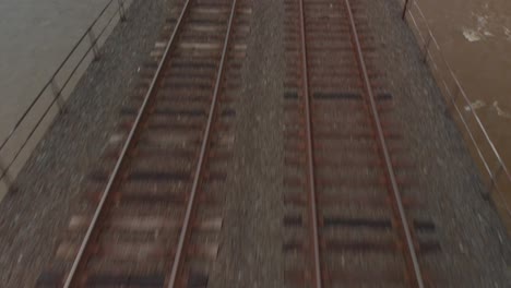Close up on railroad tracks with river below - Lancaster, Pennsylvania - No Color Grading