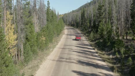 Aerial-following-truck-on-dirt-road