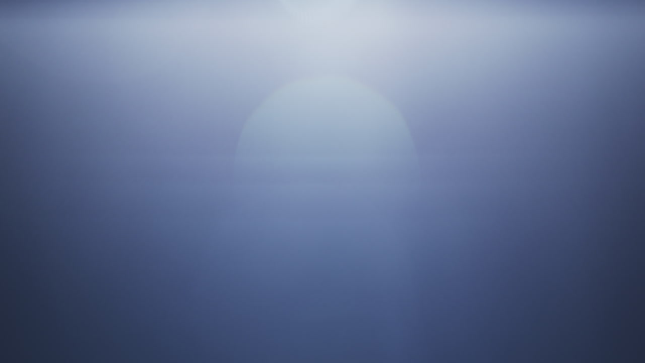 Soft blue lens flare with a gentle light gradient across a clear black background. Ideal for overlays, transitions, visual effects, or adding atmosphere to creative projects
