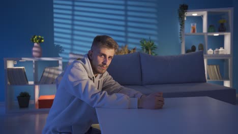 Thoughtful-young-man-sitting.