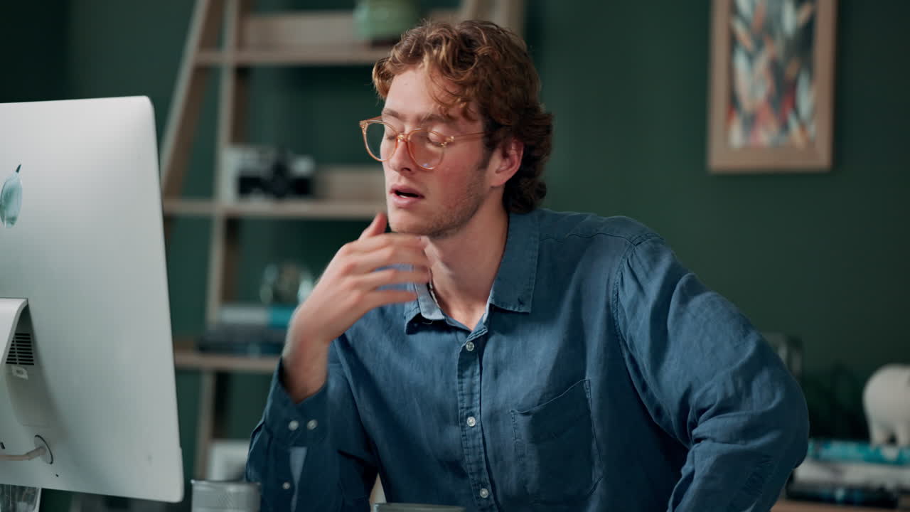 Tired man working on computer