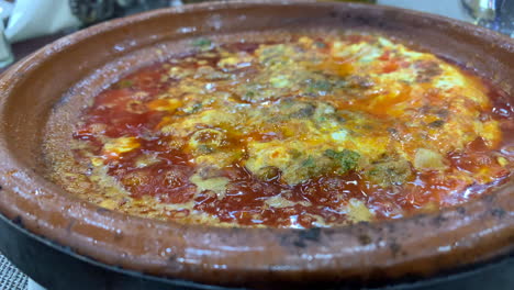 Close-Up-Hot-Bubbling-Tajine,-Tagine-Traditional-Moroccan-Dish-SLOMO