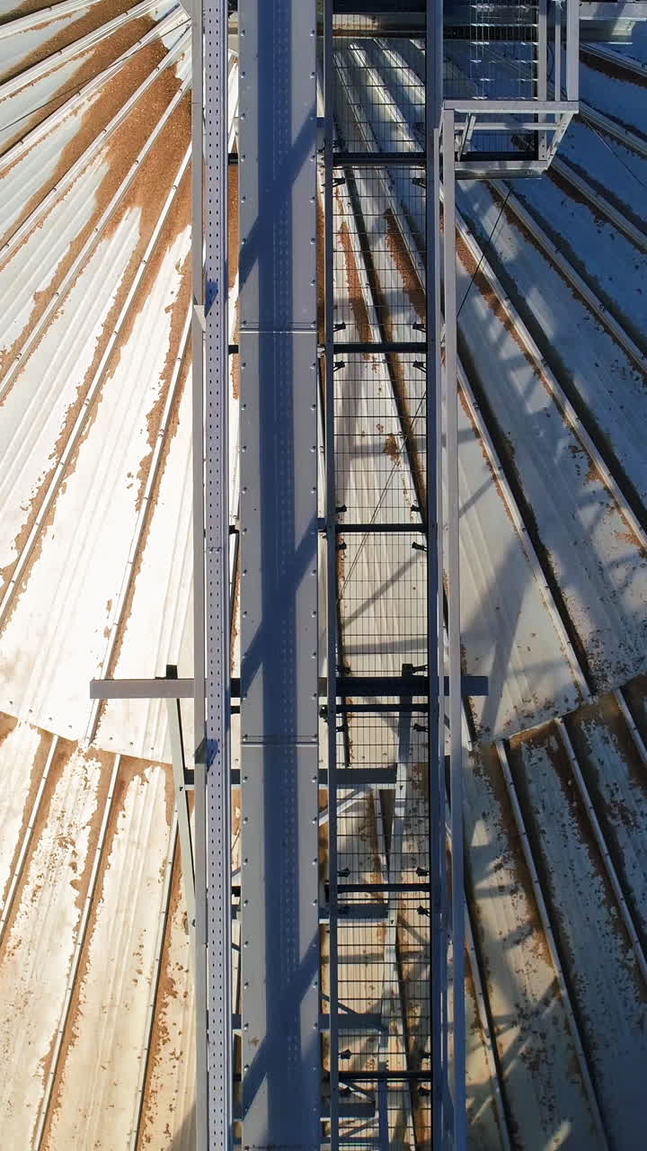 Farming elevator and granary. Storage of grain and other different cereals. Aerial view Vertical video
