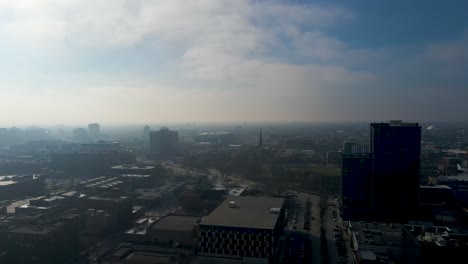 establishing-aerial-drone-shot-of-Chicago-downtown-during-a-cloudy-day-with-the-sun-piercing-through-the-clouds