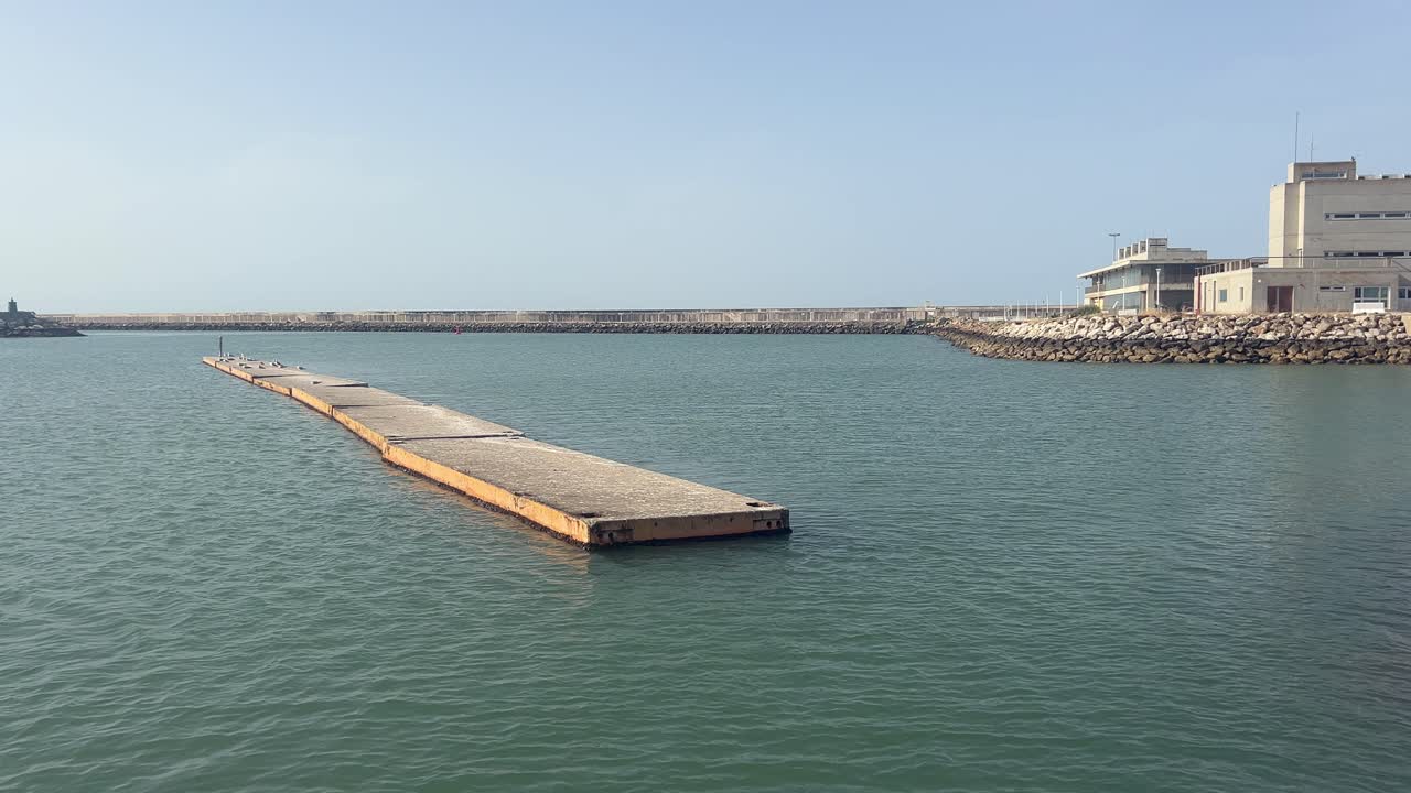 A stunning view of the sun setting over a clean, empty beach