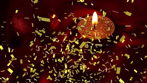 Animation-of-gold-confetti-falling-over-lit-red-candle