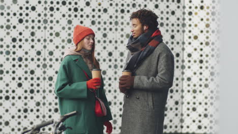 couple enjoying coffee outdoors