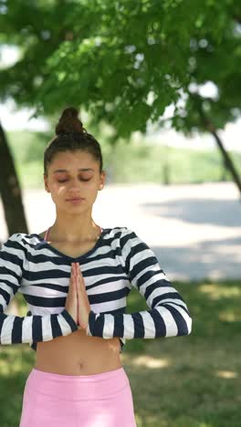 teenager practicing yoga outdoors