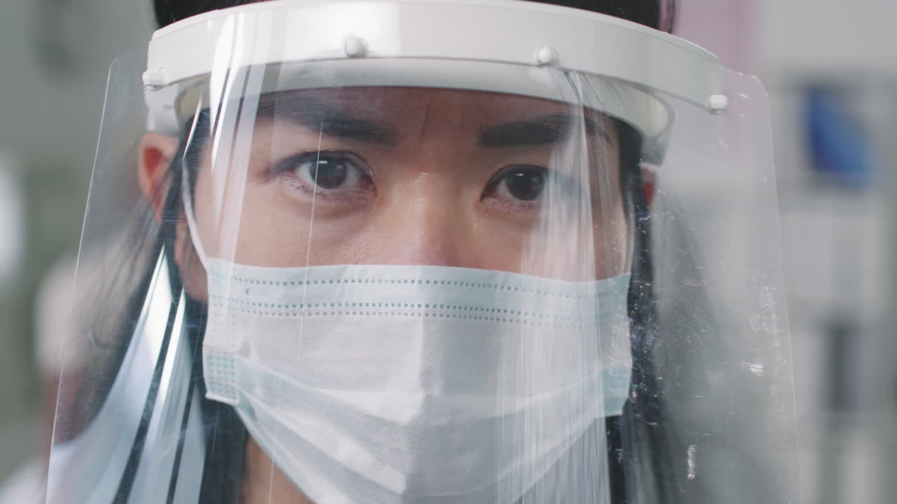 Close Up Of Doctor In Face Shield