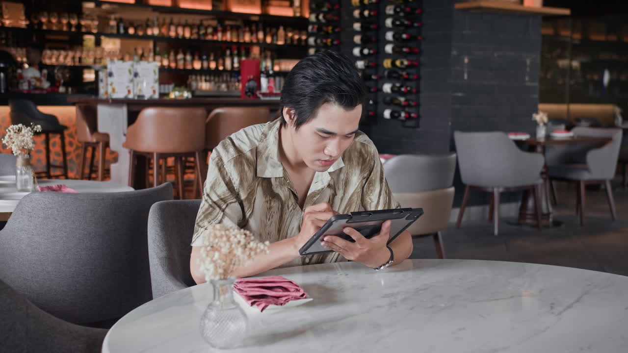 Freelancer Working in Cafe and Getting His Order from Waitress