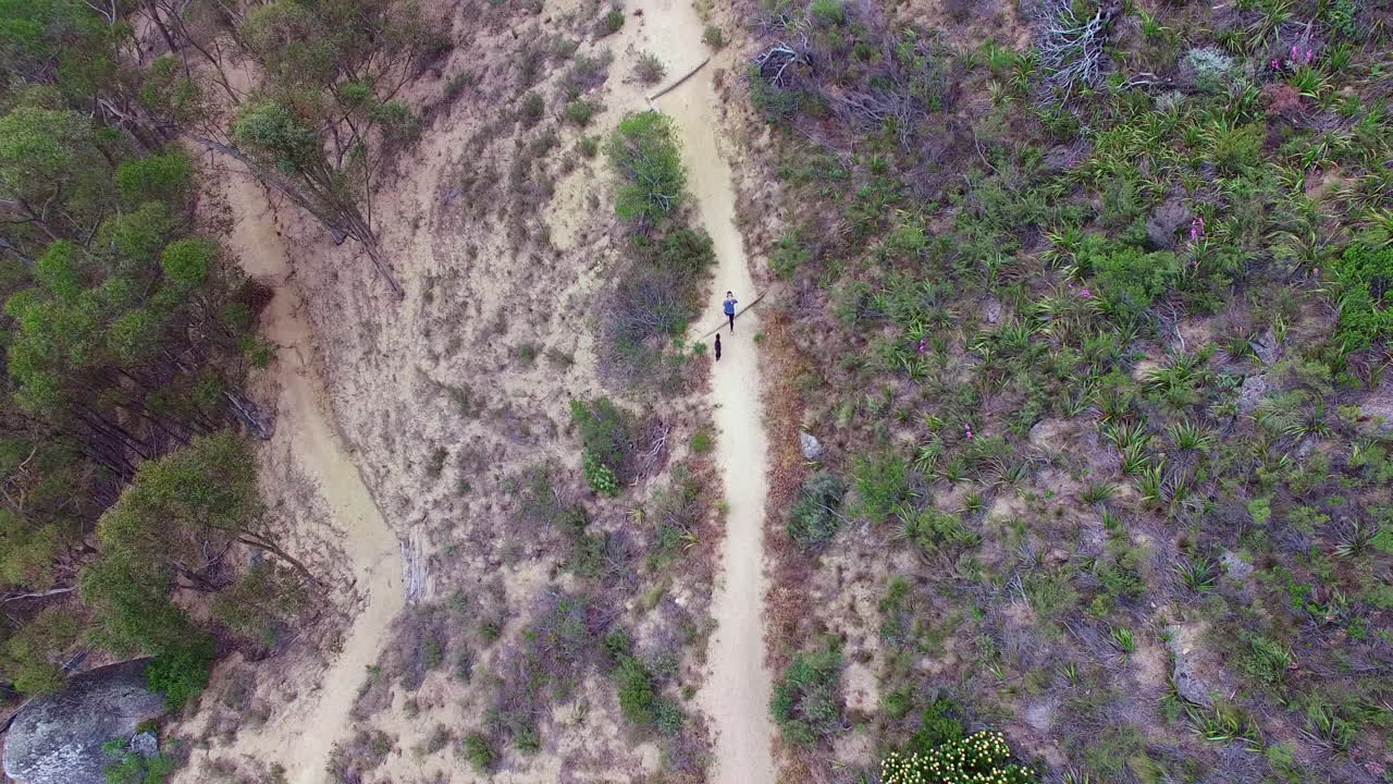 Keeping up with her dog's pace