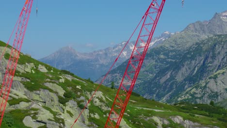 red cranes in the mountains, switzerland