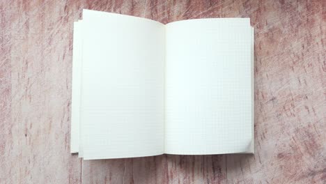 open notebook with grid paper