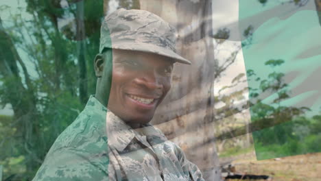 digital composition of waving nigeria flag against portrait of soldier smiling at training camp