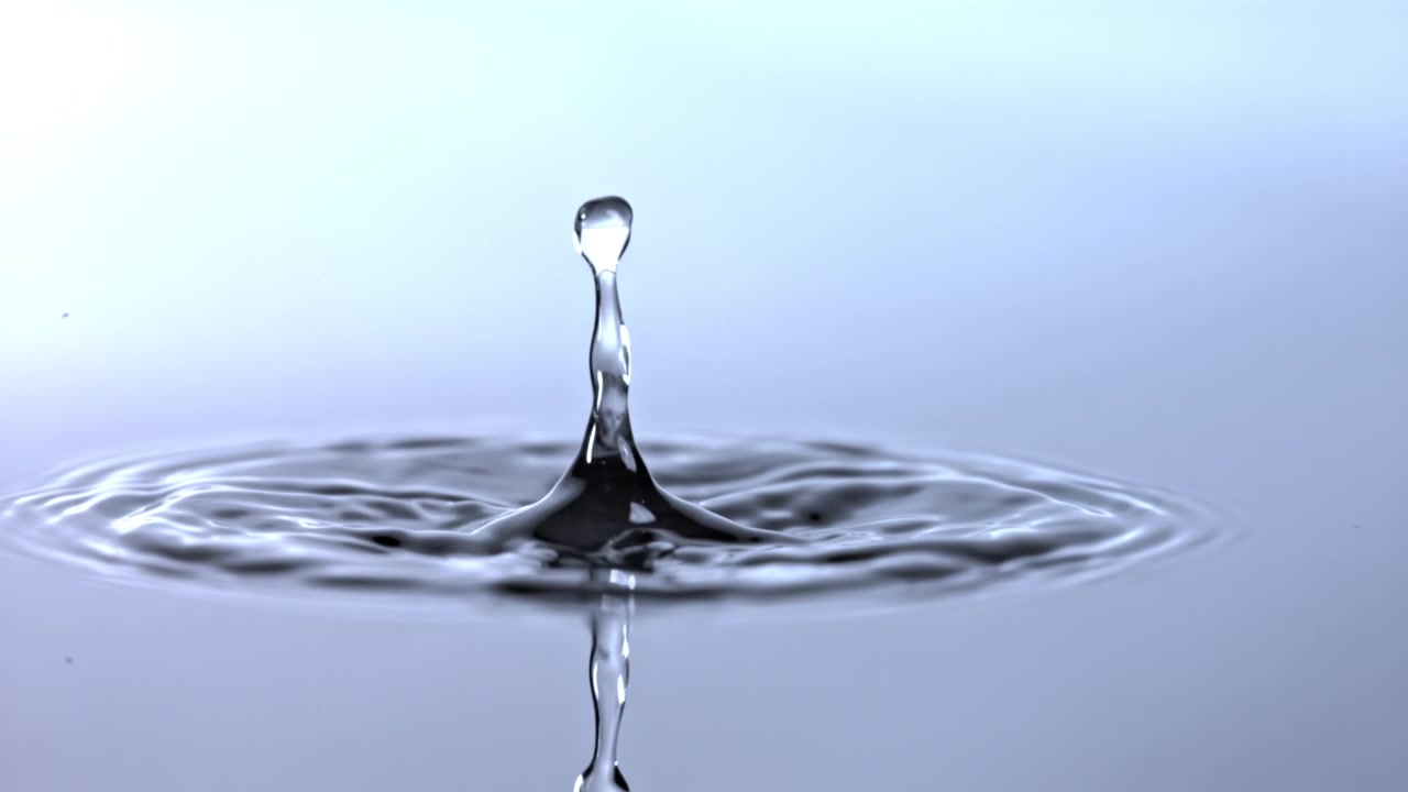 Slow Motion Water Droplet Falling and Creating Ripples